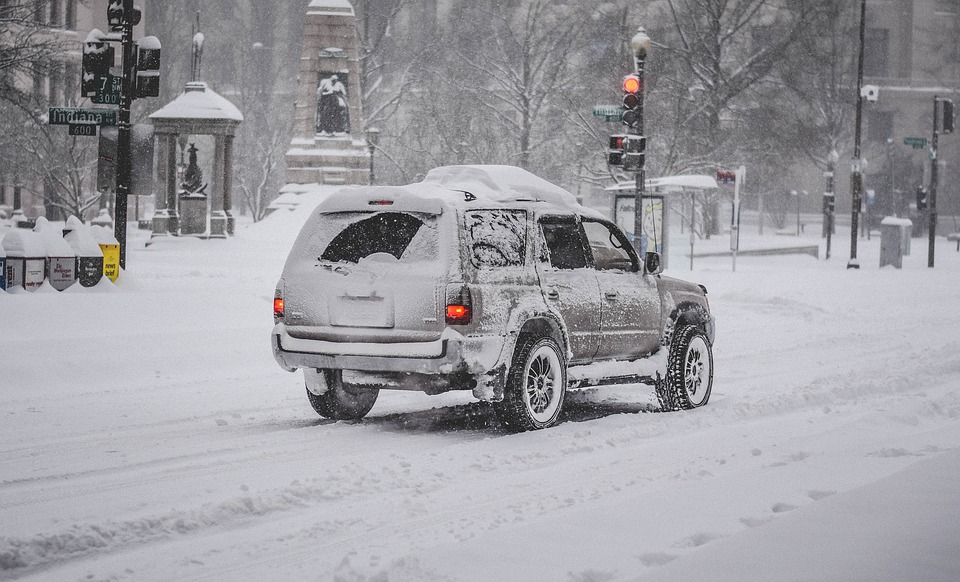 Car stuck in a snowstorm.